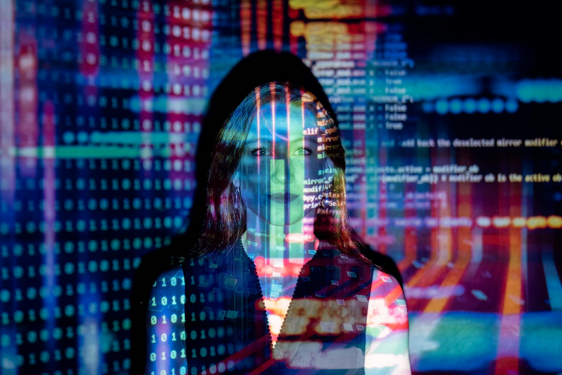 Jak wykorzystać modele językowe AI do automatyzacji zadań w dziale IT i DevOps Kobieta z nałożonym kodem cyfrowym na twarzy symbolizująca AI w IT